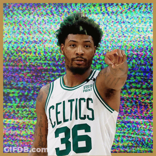 A Basketball Player Wearing A Celtics Jersey Pointing GIF