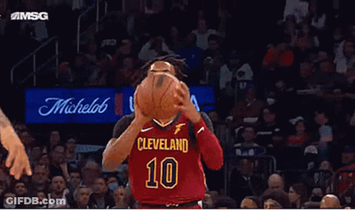 A Basketball Player Wearing A Cleveland 10 Jersey Is About To Shoot The Ball . GIF