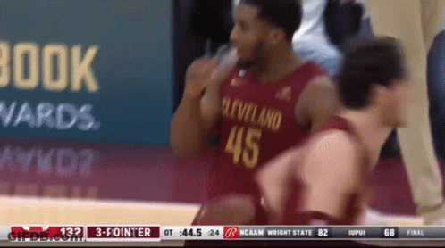 A Basketball Player Wearing A Cleveland 45 Jersey Talks To Another Player GIF