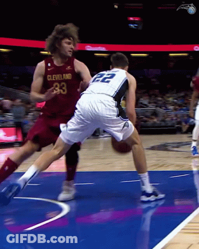 A Basketball Player Wearing A Cleveland Jersey Tries To Get Past Another Player Wearing A 22 Jersey GIF