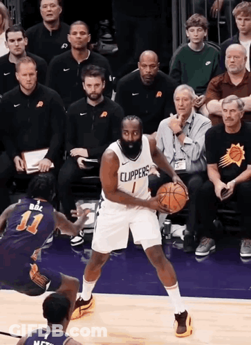 A Basketball Player Wearing A Clippers Jersey Dribbles The Ball GIF