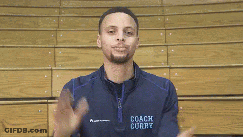 A Basketball Player Wearing A Coach Curry Jacket Is Smiling GIF