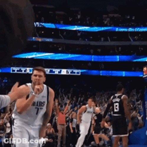 A Basketball Player Wearing A Dallas Jersey Covering His Mouth GIF