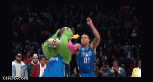 A Basketball Player Wearing A Dallas Jersey Is Going For A Dunk GIF
