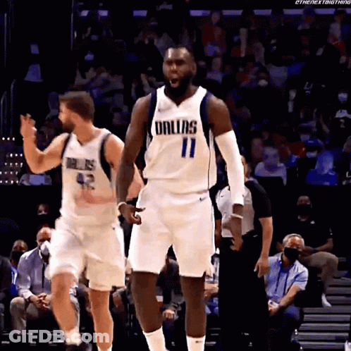 A Basketball Player Wearing A Dallas Uniform Is Standing On The Court GIF