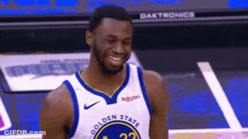 A Basketball Player Wearing A Golden State Jersey Smiles On The Court GIF