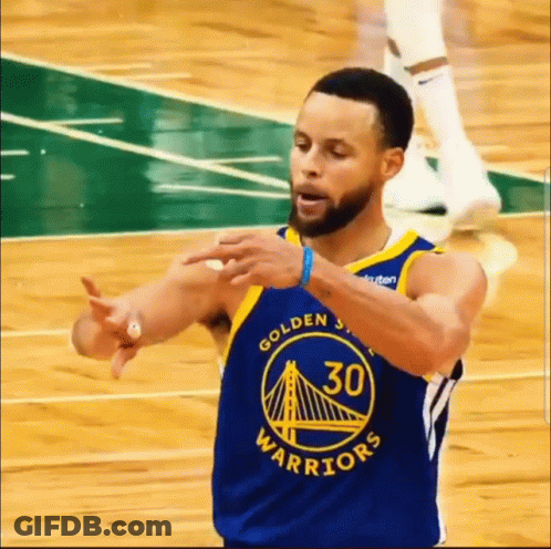 A Basketball Player Wearing A Golden State Warriors Jersey Is Making A Gesture With His Hands . GIF