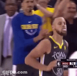 A Basketball Player Wearing A Golden State Warriors Jersey Stands In Front Of A Crowd During A Game . GIF
