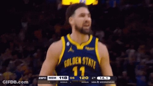 A Basketball Player Wearing A Golden State Warriors Uniform GIF