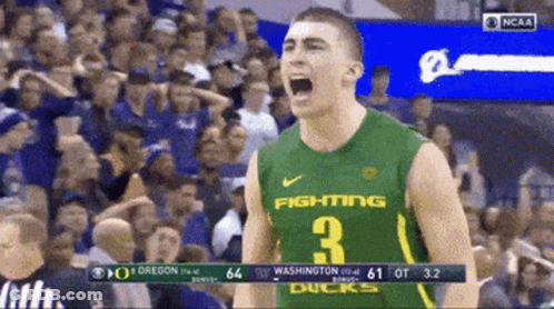 A Basketball Player Wearing A Green Jersey That Says Fighting 3 GIF
