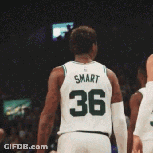 A Basketball Player Wearing A Green Jersey With Boston On It GIF