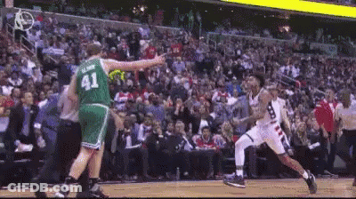 A Basketball Player Wearing A Green Jersey With The Number 41 GIF