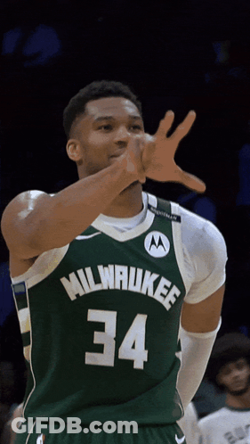 A Basketball Player Wearing A Green Milwaukee Jersey Number 34 GIF