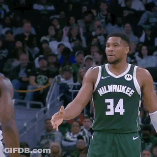 A Basketball Player Wearing A Green Milwaukee Jersey GIF