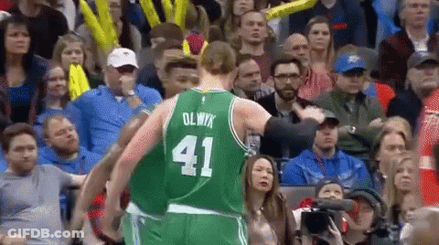 A Basketball Player Wearing A Green Uniform With The Number 41 On It GIF