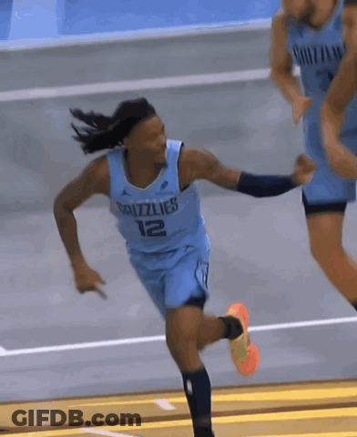 A Basketball Player Wearing A Grizzlies Jersey Is Running On A Court GIF