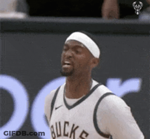 A Basketball Player Wearing A Headband And A White Jersey With The Word Buck On It GIF