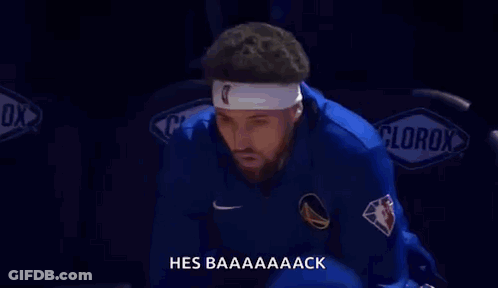 A Basketball Player Wearing A Headband Is Sitting In The Stands At A Game . GIF