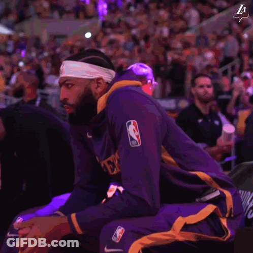 A Basketball Player Wearing A Headband That Says La On It GIF