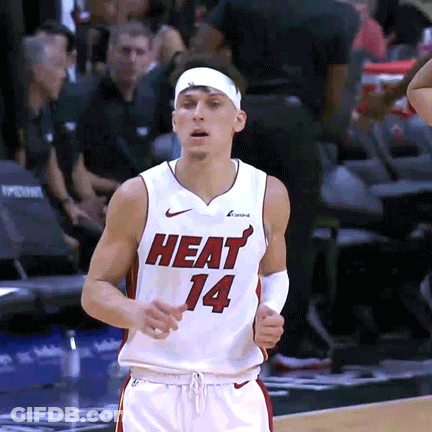A Basketball Player Wearing A Heat 14 Jersey Runs On The Court GIF