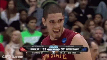 A Basketball Player Wearing A Iowa State Jersey Is Smiling In Front Of A Crowd GIF