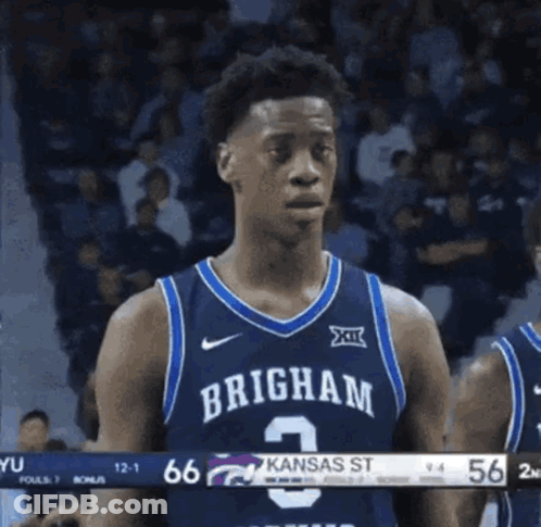 A Basketball Player Wearing A Jersey That Says Brigham 2 GIF