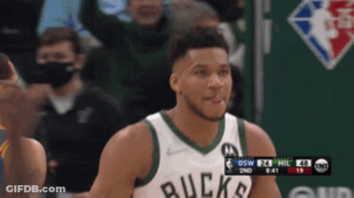 A Basketball Player Wearing A Jersey That Says Buck On It GIF