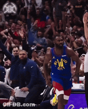 A Basketball Player Wearing A Jersey That Says Denver City GIF