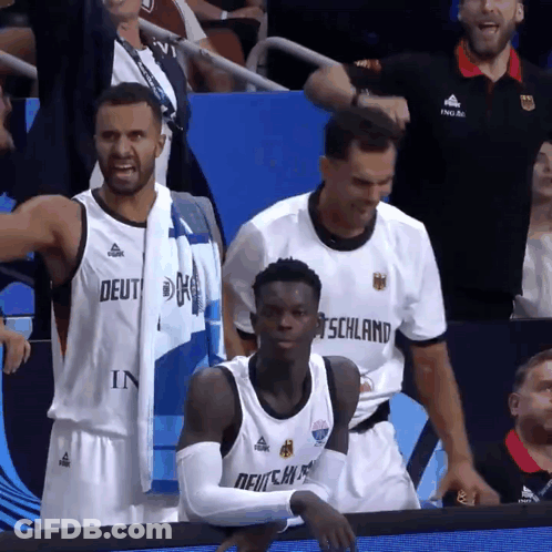 A Basketball Player Wearing A Jersey That Says Deutschland On It GIF