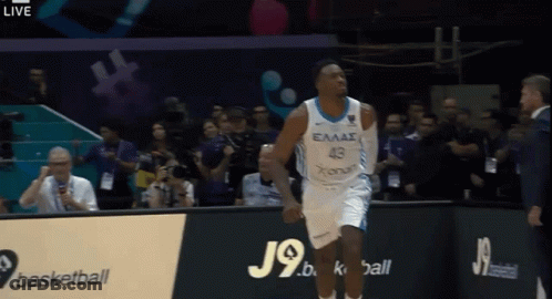 A Basketball Player Wearing A Jersey That Says Eaas On It GIF
