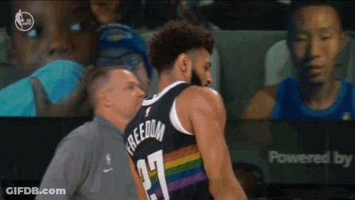 A Basketball Player Wearing A Jersey That Says Freedom GIF