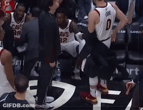A Basketball Player Wearing A Jersey That Says Love Is Being Helped Off The Court GIF