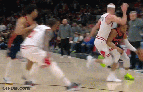 A Basketball Player Wearing A Jersey That Says ' Nuggets ' On It GIF