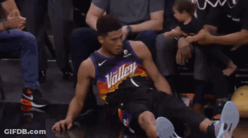 A Basketball Player Wearing A Jersey That Says " Phoenix " On It GIF