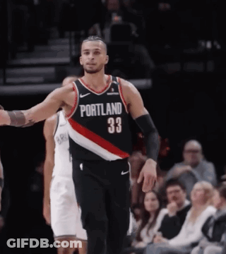 A Basketball Player Wearing A Jersey That Says Portland On It GIF