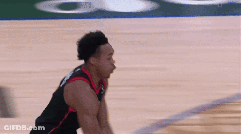 A Basketball Player Wearing A Jersey That Says ' Raptors ' On It GIF