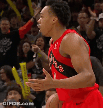 A Basketball Player Wearing A Jersey That Says Toronto Raptors GIF