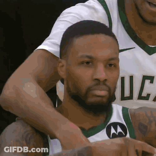 A Basketball Player Wearing A Jersey That Says Uc GIF