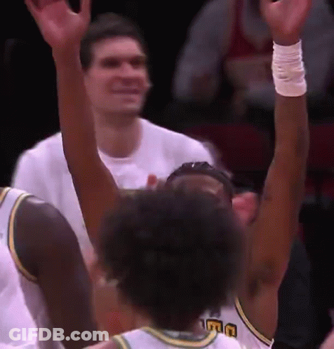 A Basketball Player Wearing A Jersey That Says Uc On It GIF