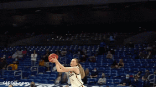 A Basketball Player Wearing A Jersey That Says Uconn On It GIF