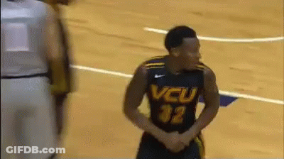 A Basketball Player Wearing A Jersey That Says Vcu On It GIF