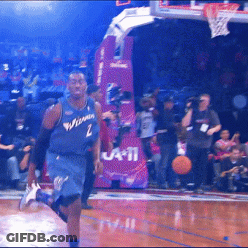 A Basketball Player Wearing A Jersey That Says Washington GIF