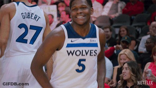 A Basketball Player Wearing A Jersey That Says Wolves GIF