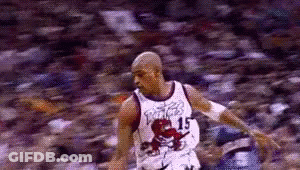 A Basketball Player Wearing A Jersey With A Dinosaur On It Is Running On A Court . GIF