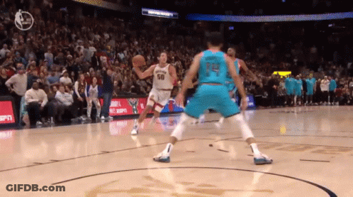 A Basketball Player Wearing A Jersey With The Number 14 On It GIF