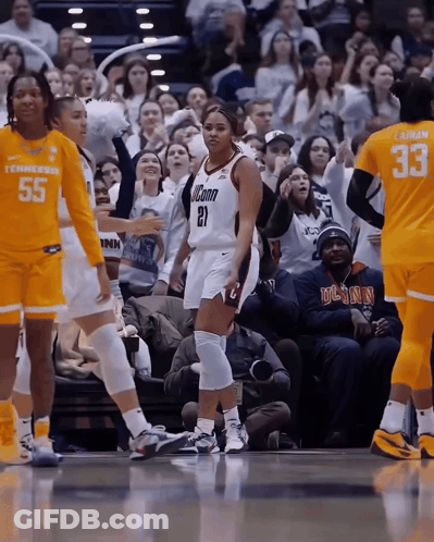 A Basketball Player Wearing A Jersey With The Number 21 GIF