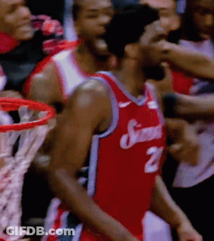 A Basketball Player Wearing A Jersey With The Number 21 On It GIF