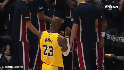A Basketball Player Wearing A Jersey With The Number 23 On It GIF