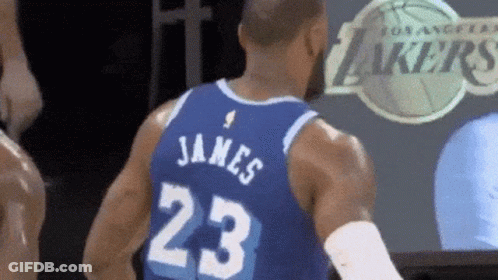 A Basketball Player Wearing A Jersey With The Number 23 On It GIF