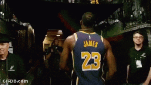 A Basketball Player Wearing A Jersey With The Number 23 On The Back GIF